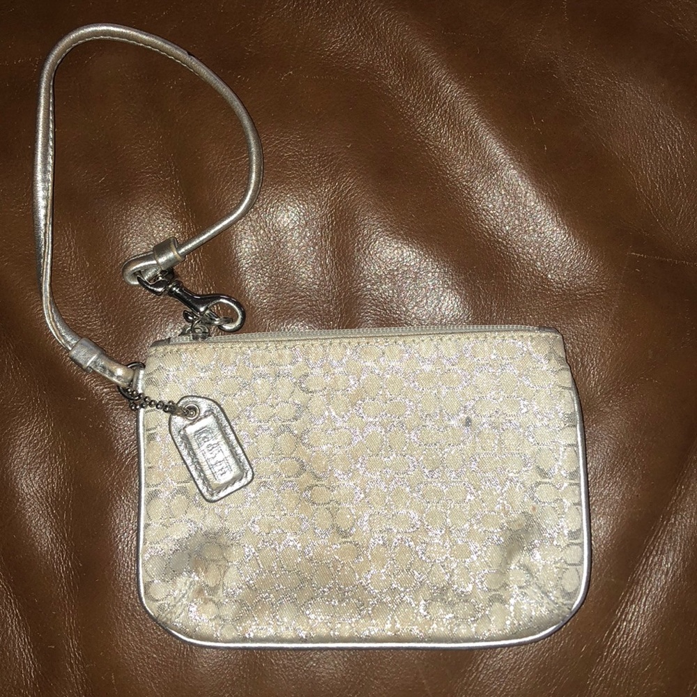 Silver metallic Coach wristlet